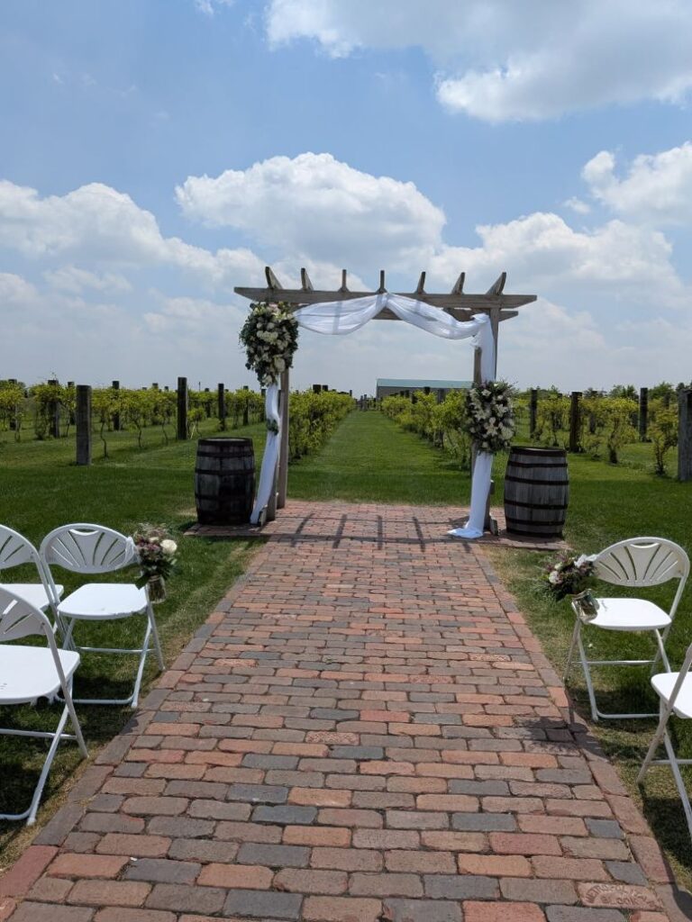 arbor arrangements with sheer drapery